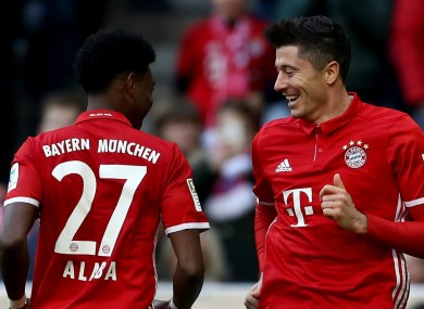 Robert Lewandowski celebrates with David Alaba.