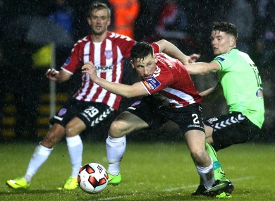 Derry's Conor McDermott and Limerick's Dean Clarke.
