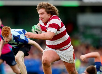 Coláiste Iognáid’s Gary Keane breaks free to score his side's first try.