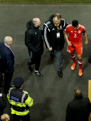 Wales’ Neil Taylor leaves the field after being red carded.