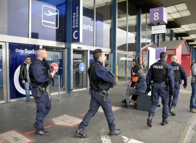 Officers walking near Orly Airport on Saturday.