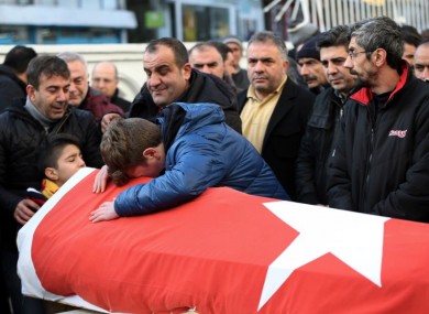 Family members and friends mourn as they attend funeral prayers for one of the victims of the attack in January.
