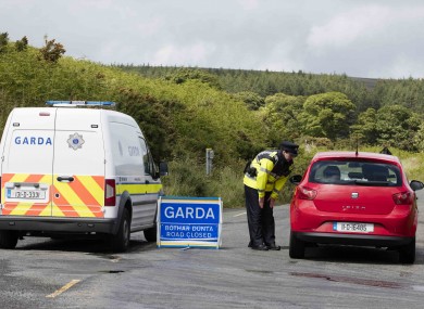 A garda at road block to the crime scene where part of a body was found by walkers on the Feartherbed Mountains on the Dublin Wicklow border.
