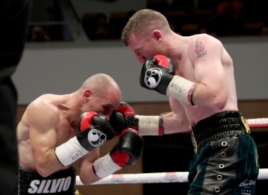 Paddy Barnes punches Silvio Olteanu.