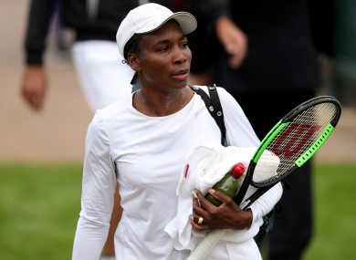 Venus Williams makes her way to the practice courts during a preview day at the The All England Lawn Tennis and Croquet Club, London.