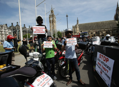 Food delivery riders demonstrate in Parliament Square.