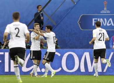 Germany's Lars Stindl, center right, celebrates after scoring.