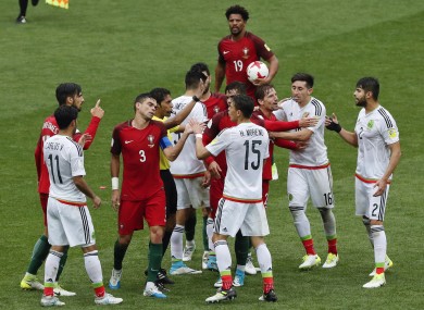 Portugal's and Mexico's players argue during the Confederations Cup, third place match.