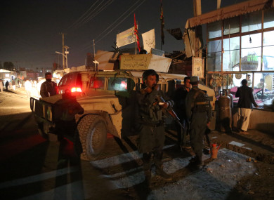 Afghan security forces stand at the site of an attack at a Shiite mosque in Kabul.