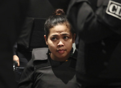 Vietnamese Doan Thi Huong is escorted by police at Kuala Lumpur International Airport in Sepang, Malaysia
