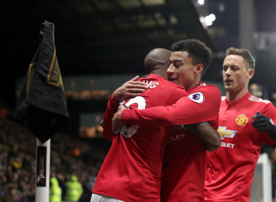 Manchester United's Ashley Young (left) celebrates scoring his side's first goal.