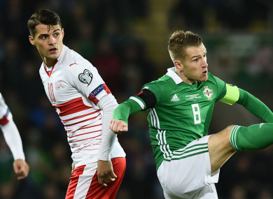 Granit Xhaka of Switzerland and Northern Ireland's Steven Davis