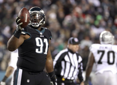 Philadelphia Eagles' Fletcher Cox reacts after a Oakland Raiders fumble.