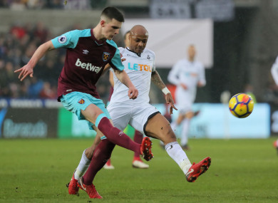 Rice in action for West Ham against Swansea's Andre Ayew.