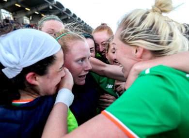 Hero: Amber Barrett, second left, celebrates her late winner.