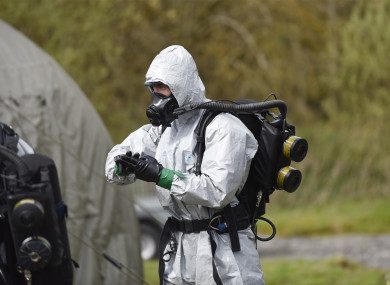 An EOD technician preps prior to entering the aircraft fuselage to inspect the scene. Rigorous checks are carried out to ensure the suit is adequately sealed.