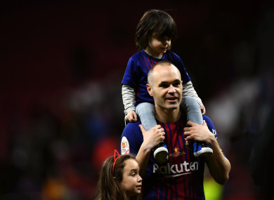 Andres Iniesta accompanies his kids after the Spanish King's Cup final match between FC Barcelona and Sevilla.