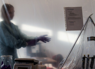 File Photo: Tropical Medicine worker prepares for work inside mobile laboratories unit (EMLab)