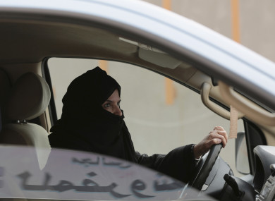 File: Aziza al-Yousef drives a car on a highway in Riyadh, Saudi Arabia, as part of a campaign to defy Saudi Arabia's ban on women driving.