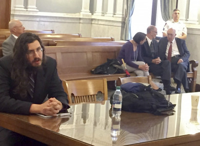 Michael Rotondo sits during an eviction proceeding in Syracuse, New York, brought by his parents, Mark and Christina.