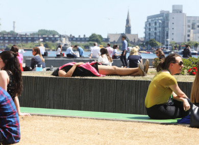 People sunbathing at the Grand Canal Dock area today.