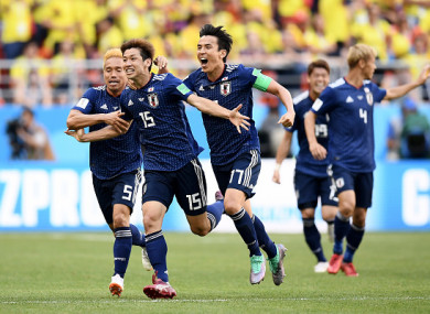 Yuya Osako celebrates restoring Japan's lead in the second half.