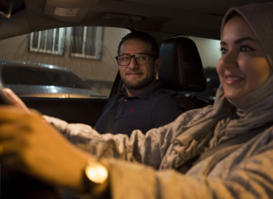 Walaa Abou Najem, with her husband Ammar Akelah, as she drives her car for the first time through the capital's streets early this morning.