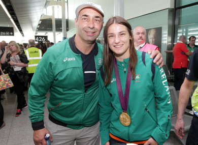 Gold medal winner Katie Taylor poses with her medal with her father Pete.