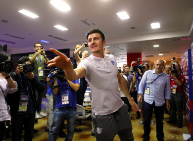 England's Harry Maguire plays darts with the media during the World Cup.