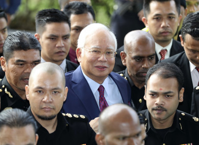 Former Malaysian prime minister Najib Razak (centre) arrives at court in Kuala Lumpur