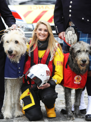 Laura Jackson from Royal National Lifeboat Institution with Darcy aged 2 from the ambulance service (L) and Seodin aged 2 from Dublin fire brigade (R)