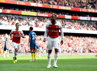 Alexandre Lacazette celebrates after Issa Diop's own goal.