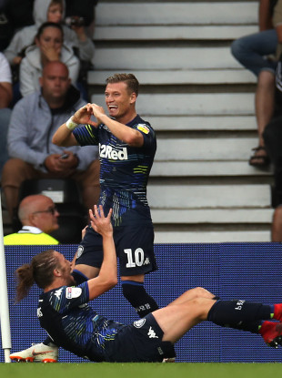 Leeds United's Ezgjan Alioski (centre) celebrates scoring his side's fourth goal of the game.