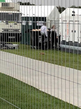 Sandwiches being dumped after the papal mass.