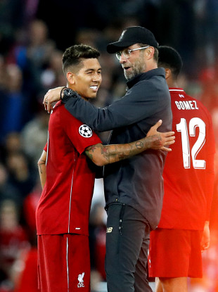 Jurgen Klopp alongside goalscorer Roberto Firmino after full time.