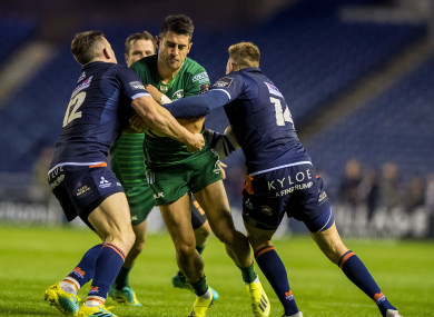 Edinburgh's Matt Scott and Dougie Fife tackle Tiernan O'Halloran of Connacht.
