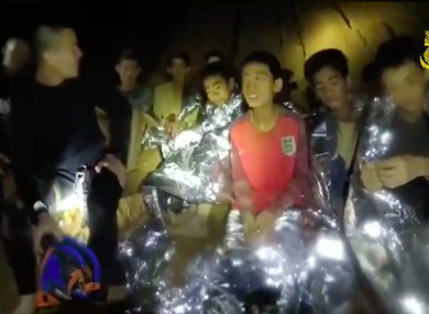 File photo: members of the Royal Thai Navy are pictured with the 12 schoolboys, members of a local soccer team, and their coach, who were trapped in the Tham Luang Cave network in Northern Thailand.
