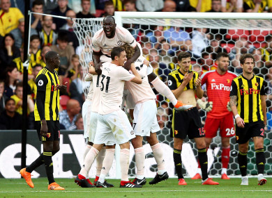 Manchester United's Chris Smalling (hidden) celebrates scoring his side's second goal of the game.