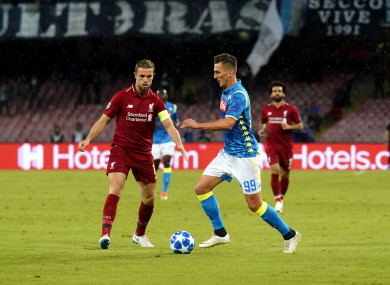 Arkadiusz Milik with Liverpool captain Jordan Henderson last night.