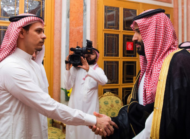 Saudi Crown Prince Mohammed bin Salman, right, shakes hands with Salah Khashoggi (victim's son) after they received him in Riyadh, Saudi Arabia.