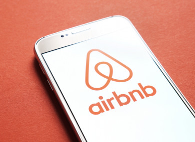 File photo of the Airbnb app on a phone