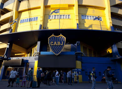 People stand outside Boca Juniors stadium in Buenos Aires.