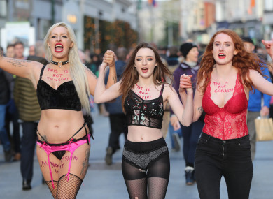 Protestors Stacie Ellen Murphy, Alanna Cassidy and Lena Seale walk in their underwear along Grafton Street, Dublin, in support of victims of sexual violence.