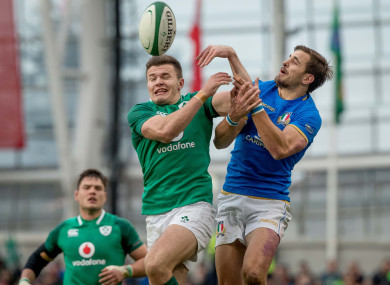 Italy's Mattia Bellini battles for possession with Ireland's Jacob Stockdale during the 2018 Six Nations fixture in Dublin.