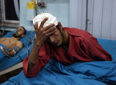 Injured men at a hospital after a suicide bombing in Kabul, Afghanistan.