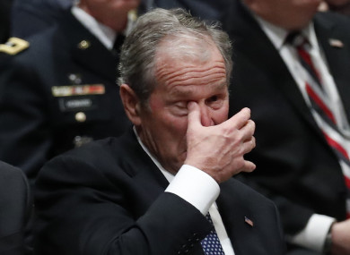 George Bush Jnr wiping a tear during the ceremony