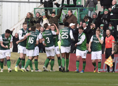 Hibernian's Florian Kamberi (22) celebrates with Steven Whittaker (3) and team-mates.