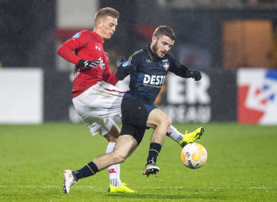 Dan Crowley of Willem II is challenged by AZ Alkmaar's Albert Gudmundsson.