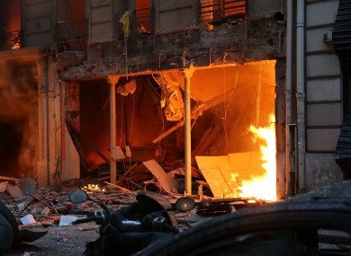Flames are seen after an explosion at a bakery in central Paris yesterday