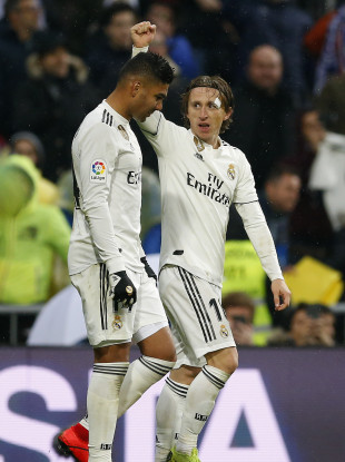 Real Madrid's Luka Modric, right, celebrates his goal with his teammate Casemiro.